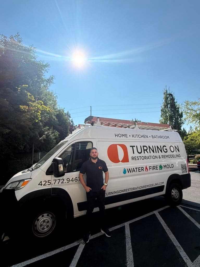 Turning On Restoration & Remodeling team and branded service van in Bellevue, WA